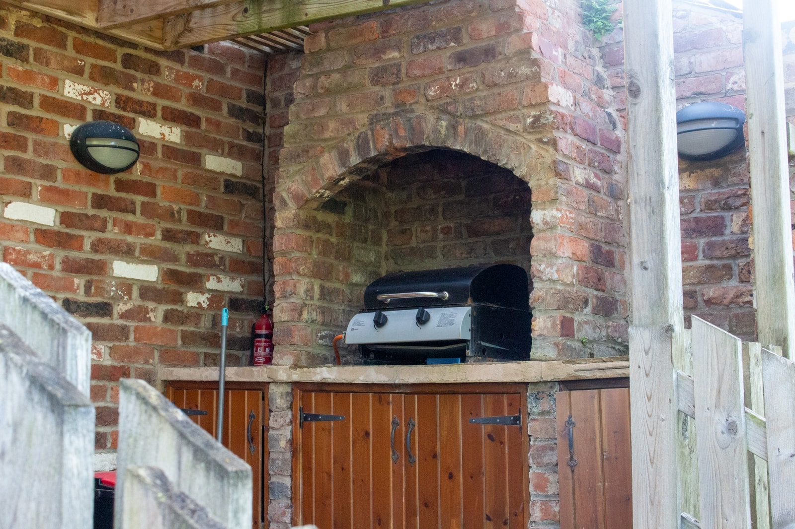 The barbecue set into its brick alcove in the courtyard