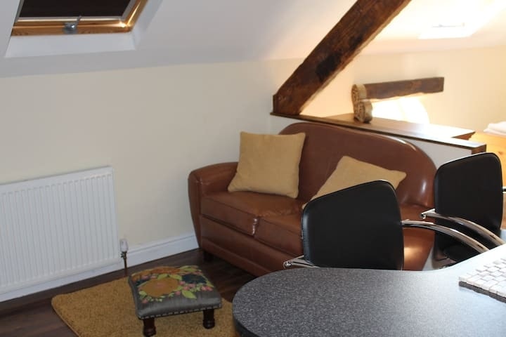 The living and dining area, with seating around a low table